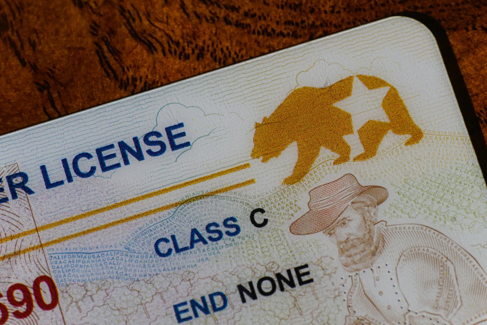 A fake or fraudulent id being checked with id scanner